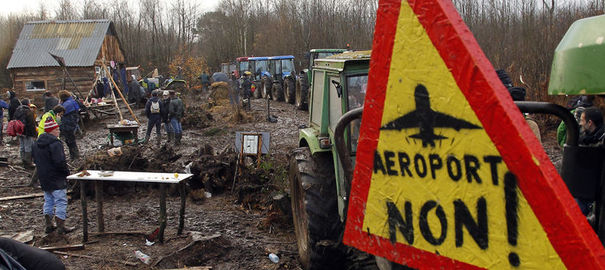 1182535 tractors-are-chained-together-outside-the-make-shift-camp-where-demonstrators-gather-as-evacuation-operations-continue-on-land-that-will-become-the-new-airport-in-notre-dame-des-landes